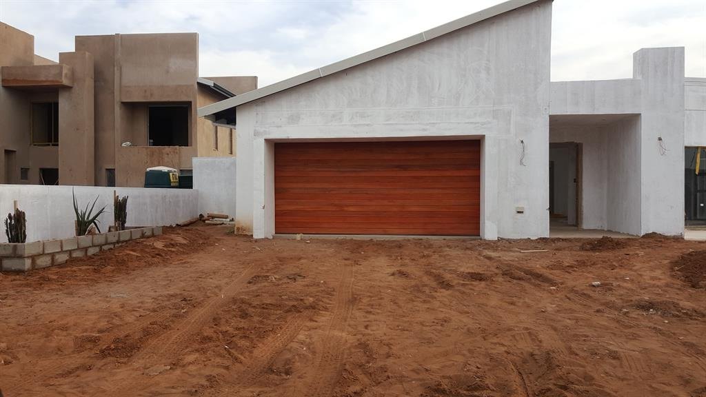 A timber garage door on a newly built house